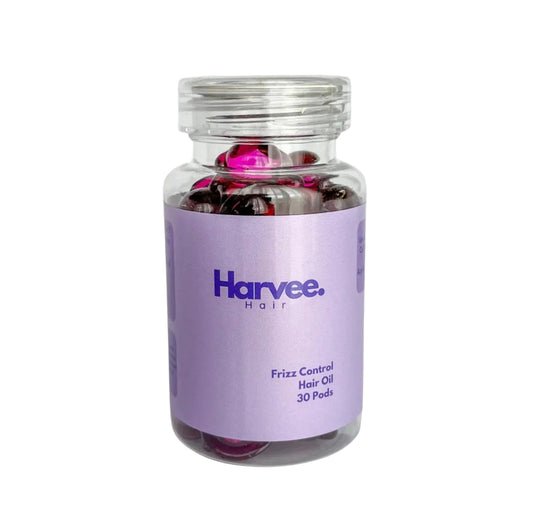 Jar of Harvee Hair Frizz Control Hair Oil on a light purple background