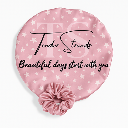 Pink satin hair scrunchie with 'Tender Strands' branding and text on a matching pink cover with star pattern.